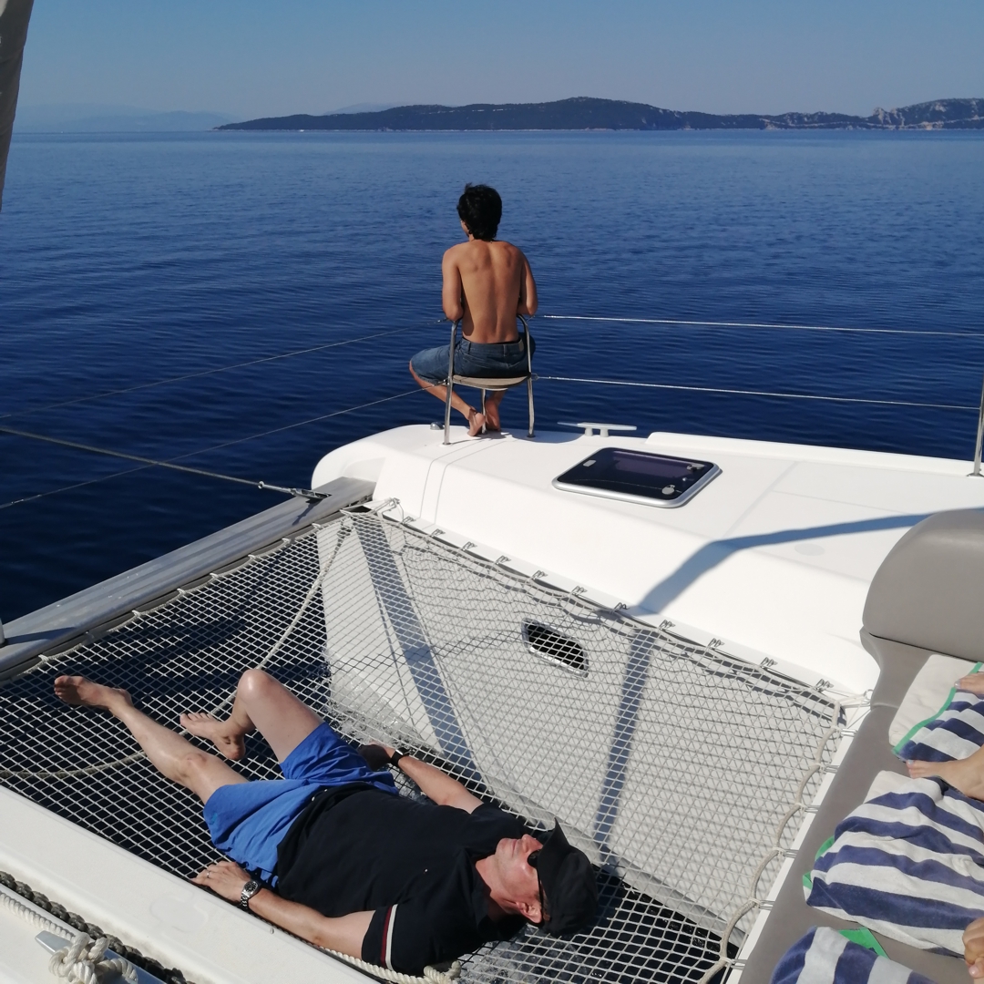 Relaxing on the catamaran whilst cruising the islands